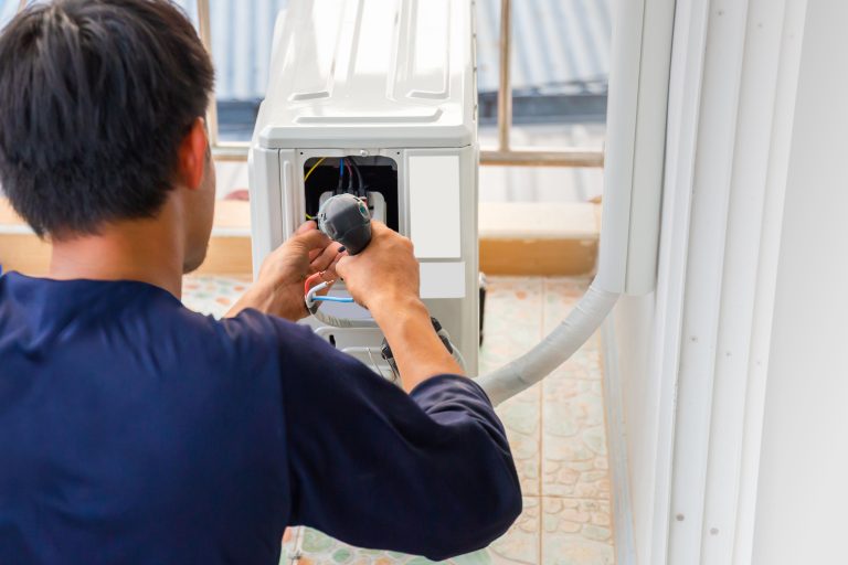 Technician performing AC installation Peoria