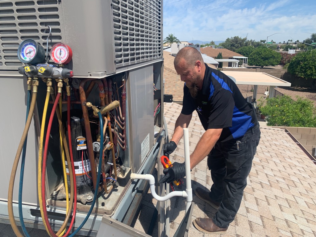 Our technician fixing an HVAC.